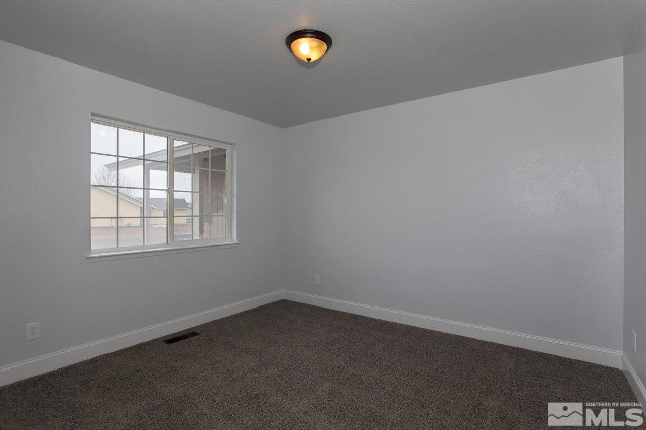 1220 Lattin Road Fallon, NV 89406 - Photo 12 of 25 an empty room with a window