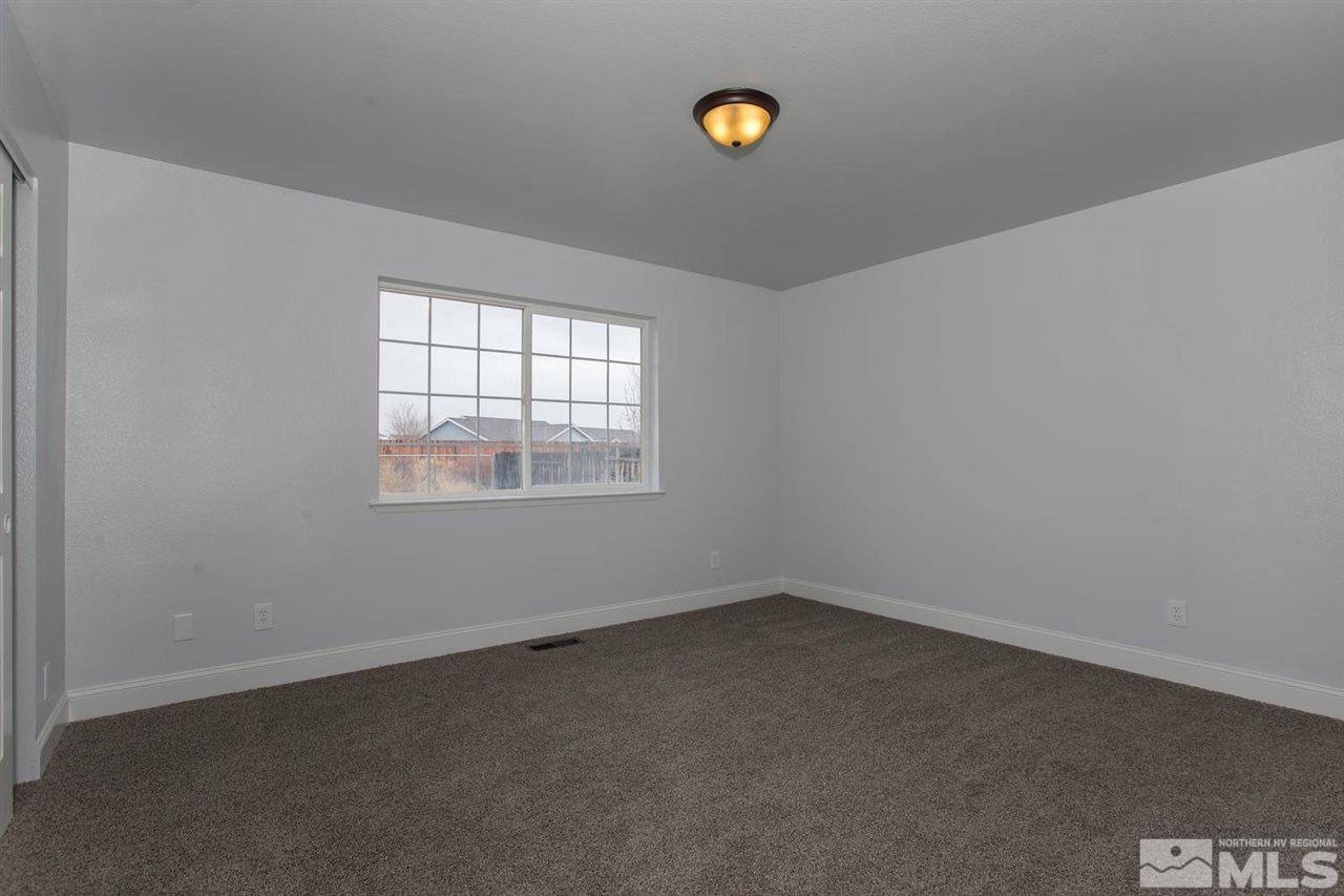 1220 Lattin Road Fallon, NV 89406 - Photo 13 of 25 an empty room with a window