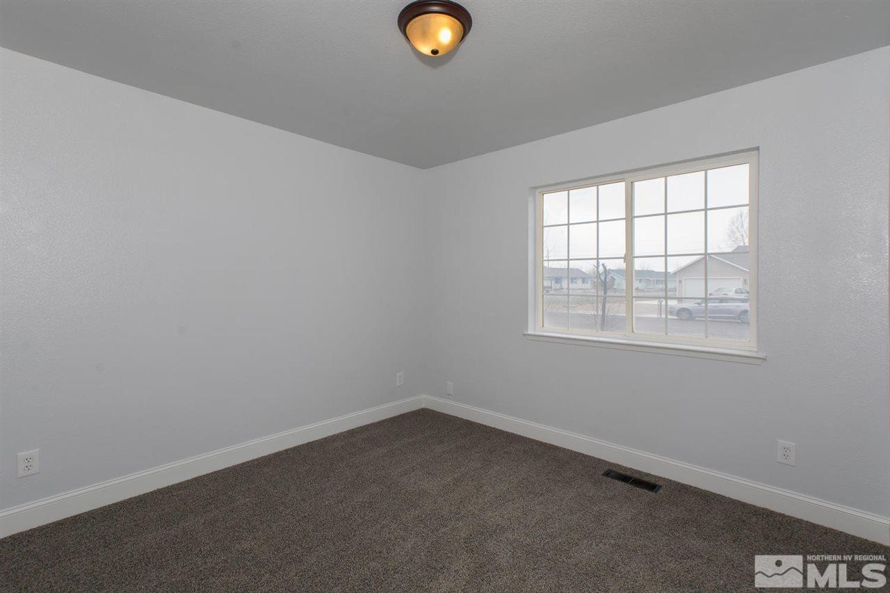 1220 Lattin Road Fallon, NV 89406 - Photo 14 of 25 an empty room with a window