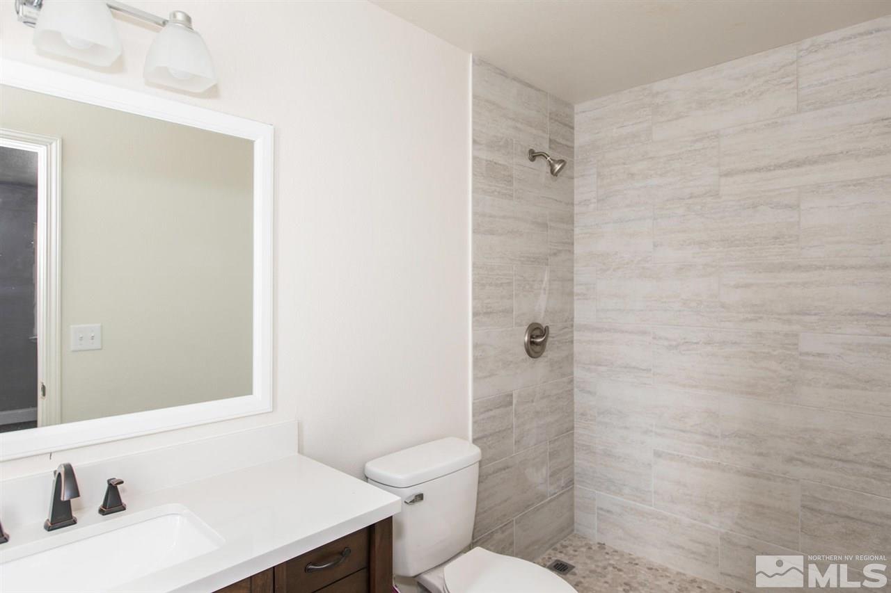 1220 Lattin Road Fallon, NV 89406 - Photo 15 of 25 a bathroom with a sink a toilet and shower