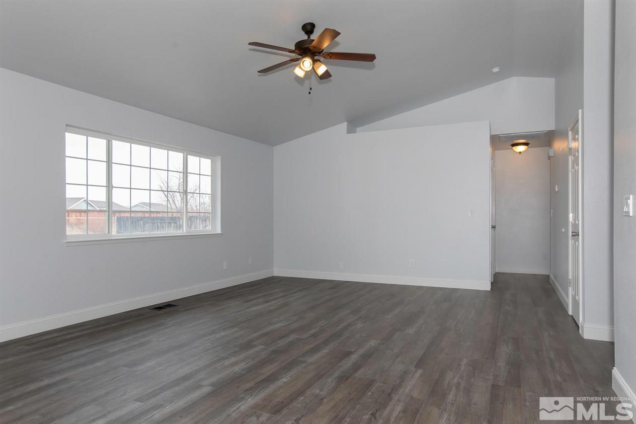 1220 Lattin Road Fallon, NV 89406 - Photo 2 of 25 wooden floor in an empty room with a window