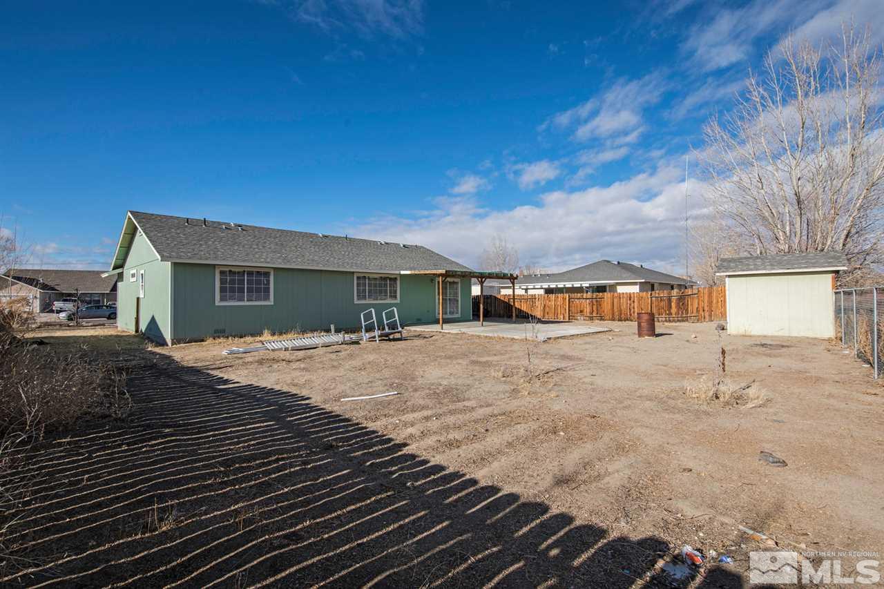 1220 Lattin Road Fallon, NV 89406 - Photo 22 of 25 a front view of a house with a yard