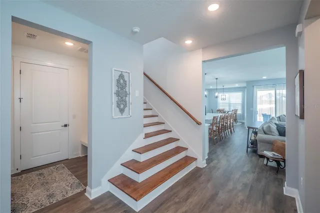 a large kitchen with kitchen island granite countertop a dining table and chairs