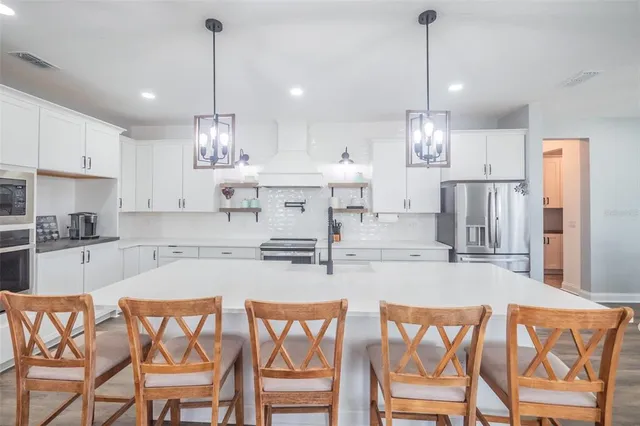 a bedroom with furniture and wooden floor