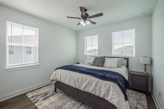 a bathroom with a shower curtain and a toilet