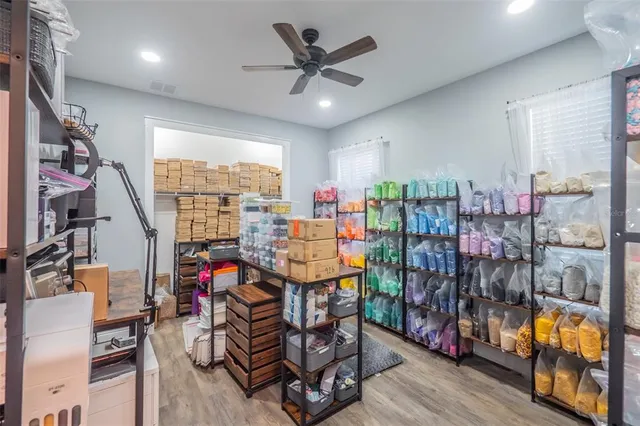 a view of walk in closet with clothes