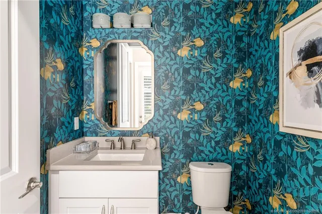 a bathroom with a toilet and a sink