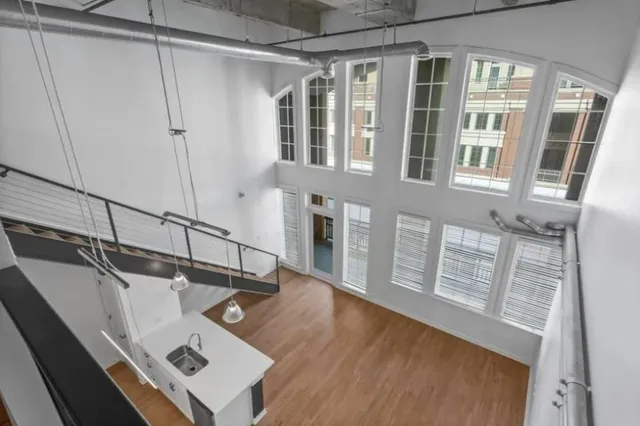 a view of a balcony with wooden floor