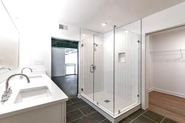 a bathroom with a sink and a shower