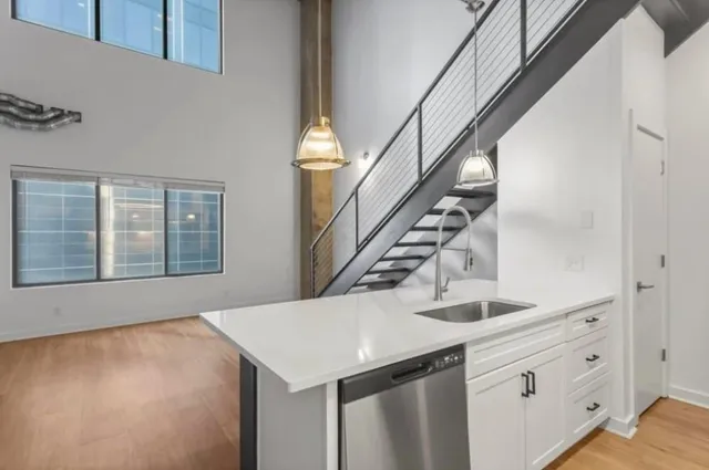 a kitchen with a cabinets and chandelier