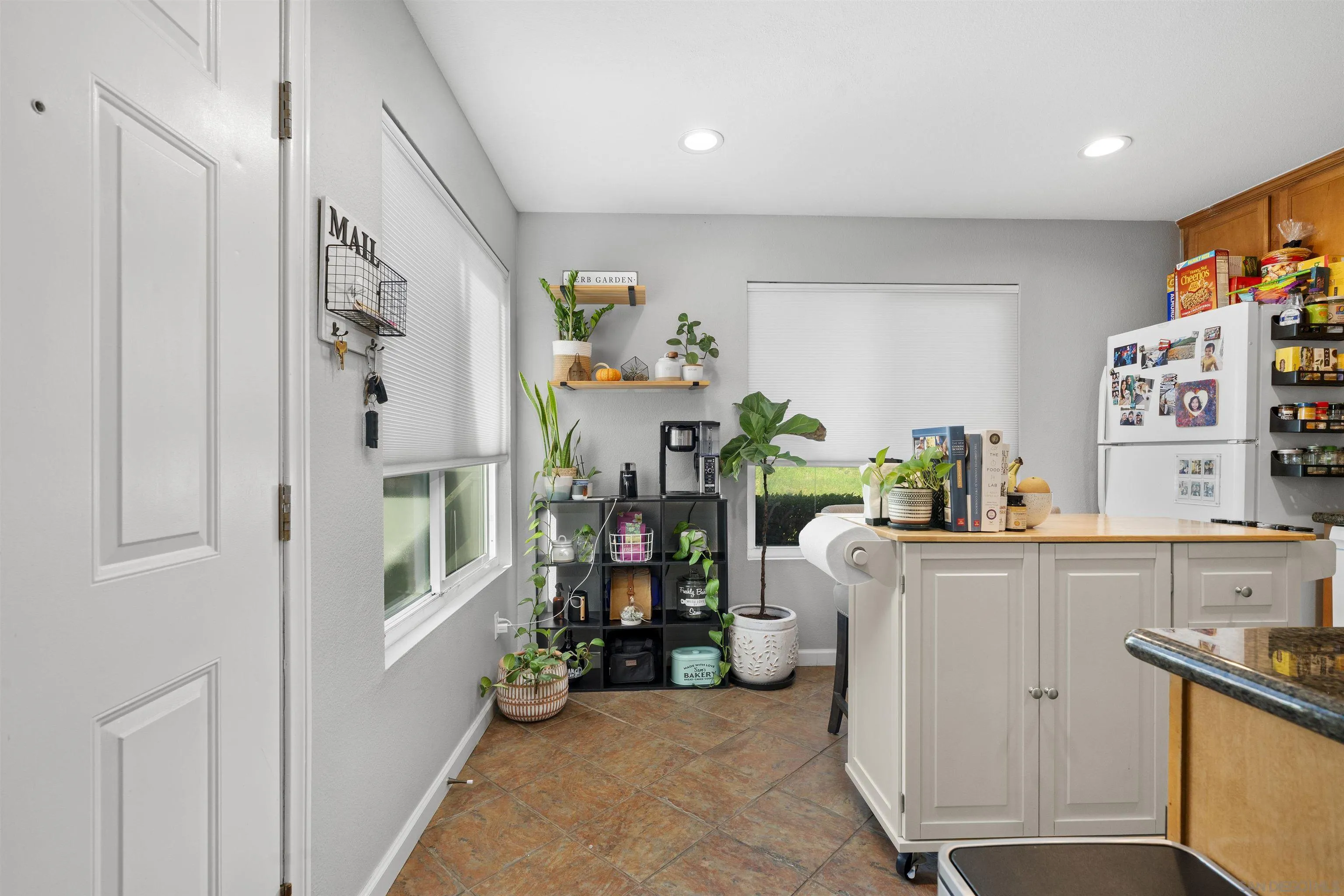 6333 College Grove Way, Unit 1101 (14) San Diego, CA 92115 - Photo 12 of 39 a view of kitchen with furniture and wooden floor