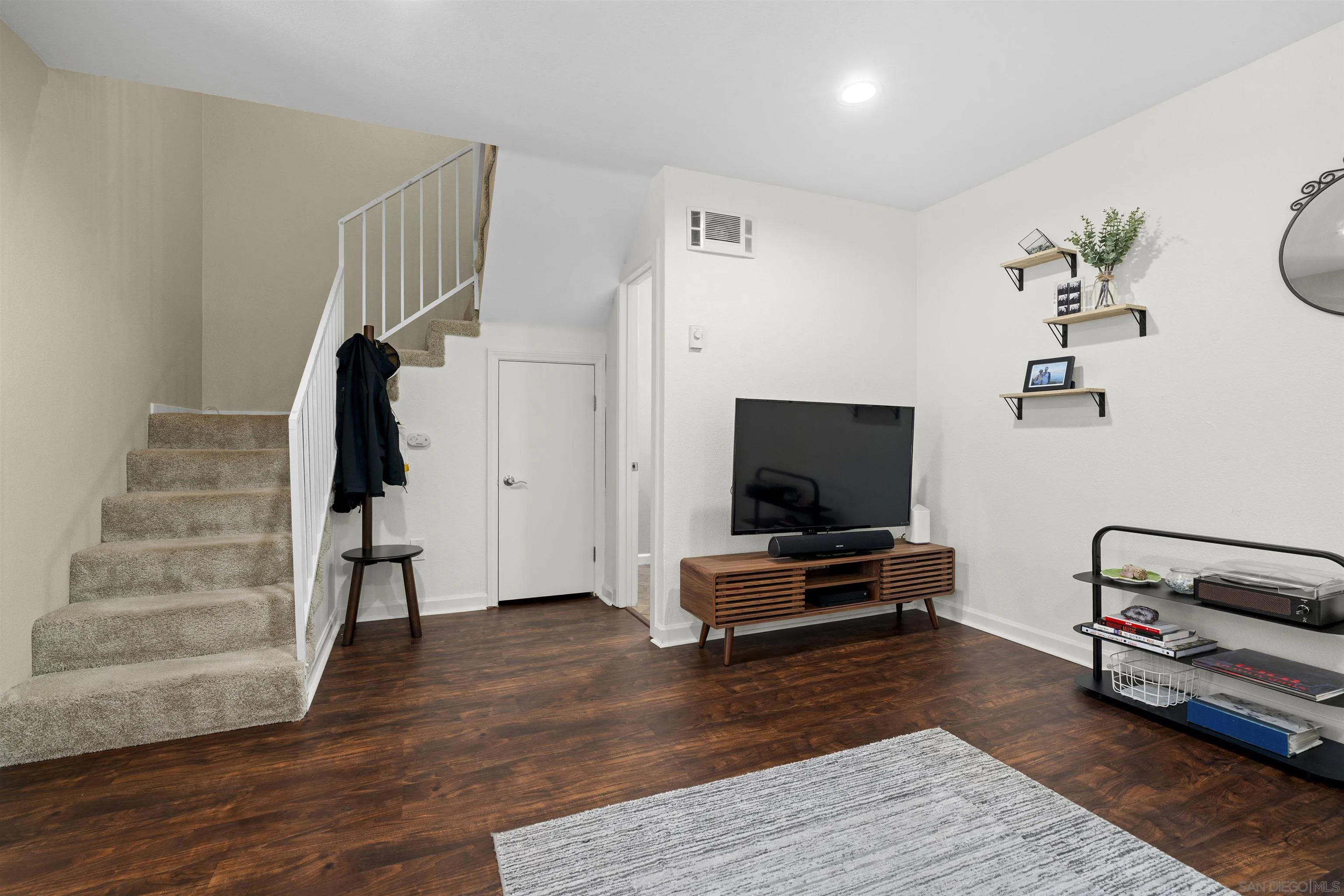 6333 College Grove Way, Unit 1101 (14) San Diego, CA 92115 - Photo 22 of 39 a living room with furniture and a flat screen tv