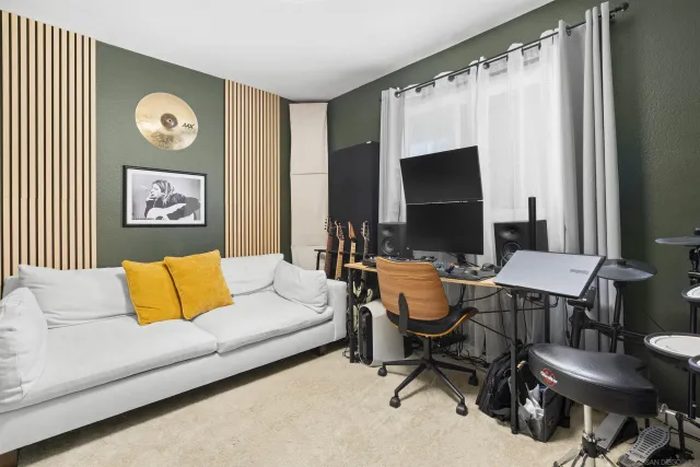a view of a livingroom with furniture and a flat screen tv