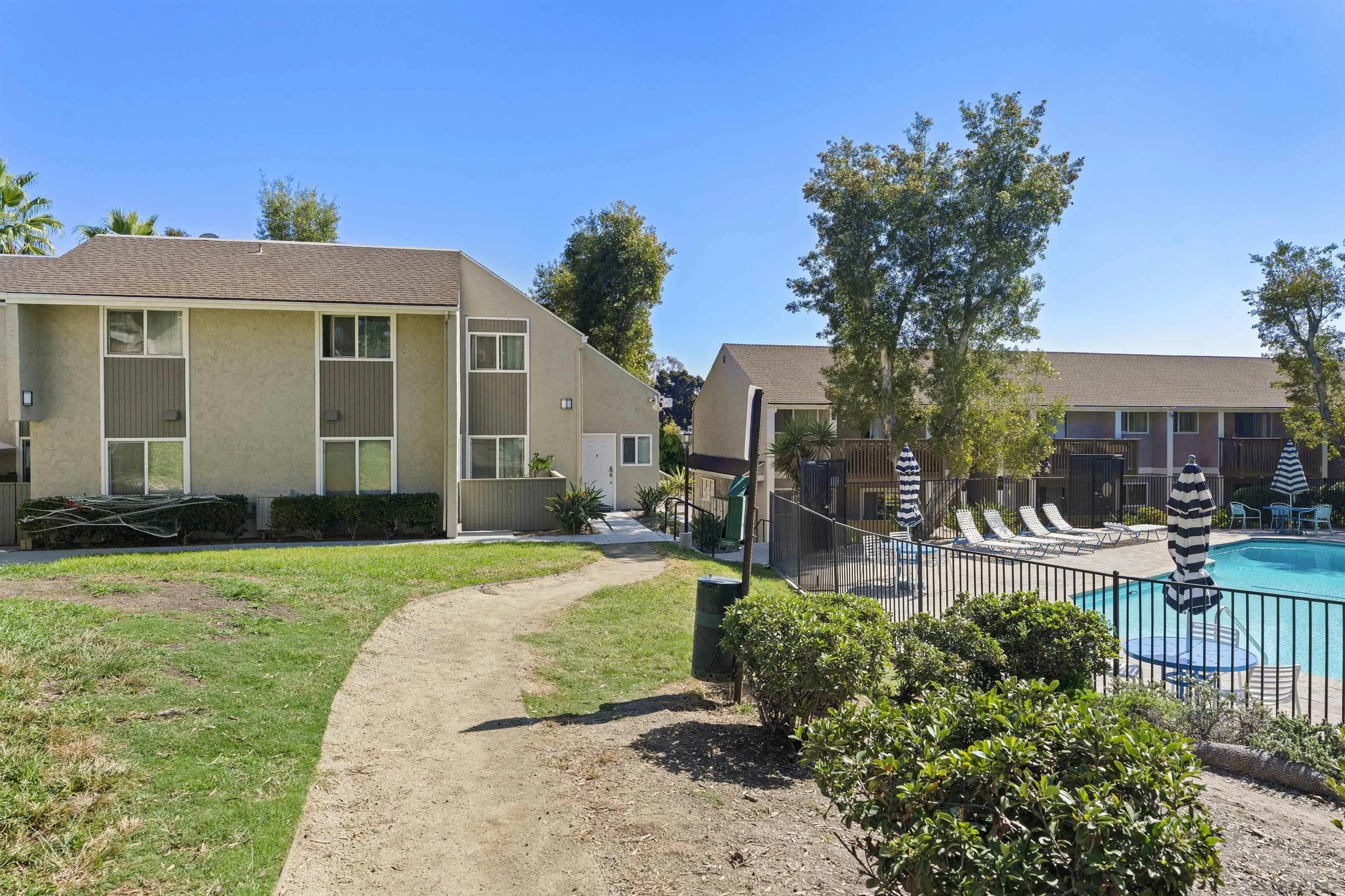 6333 College Grove Way, Unit 1101 (14) San Diego, CA 92115 - Photo 29 of 39 a front view of a house with a yard