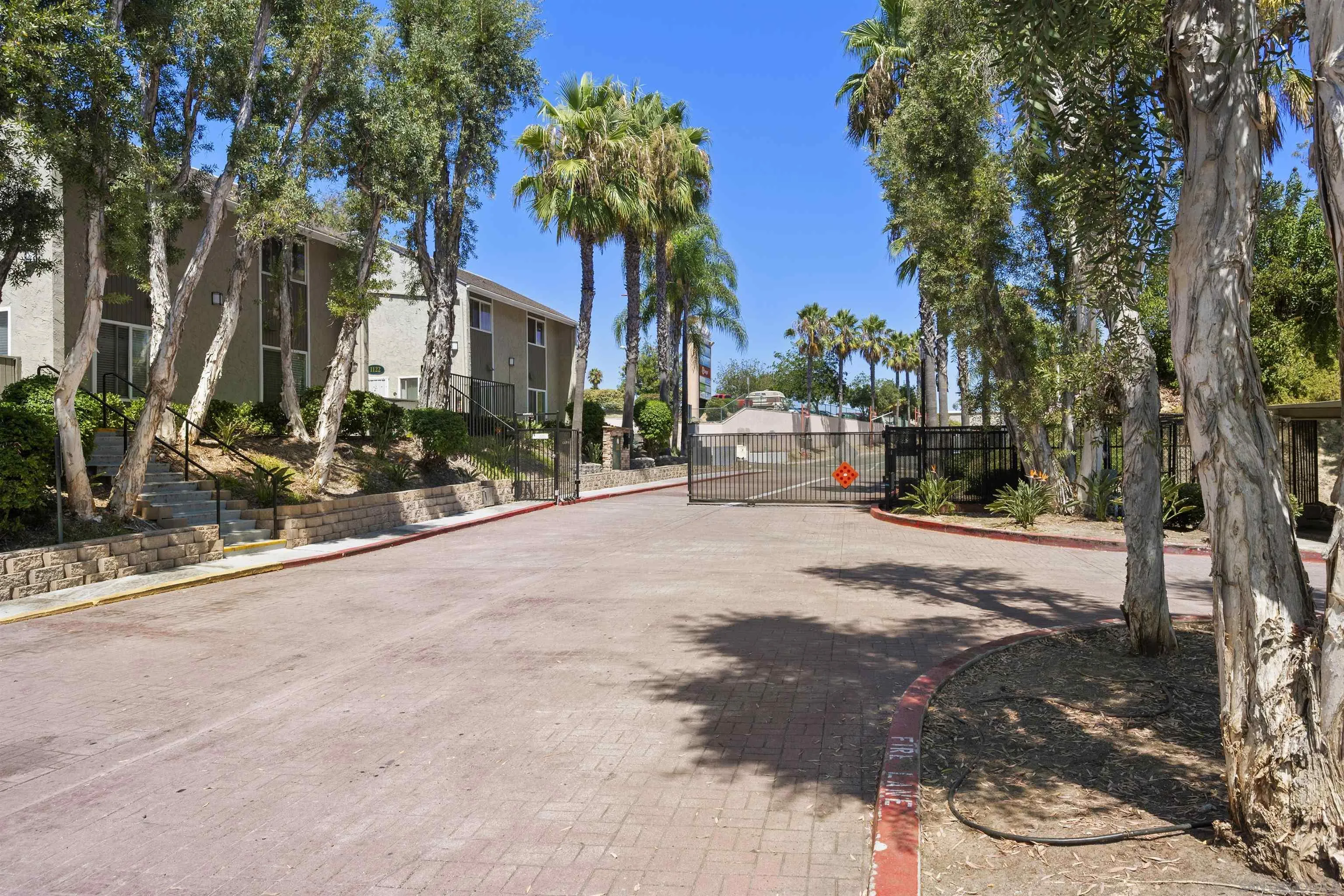 6333 College Grove Way, Unit 1101 (14) San Diego, CA 92115 - Photo 34 of 39 a view of street with tall buildings
