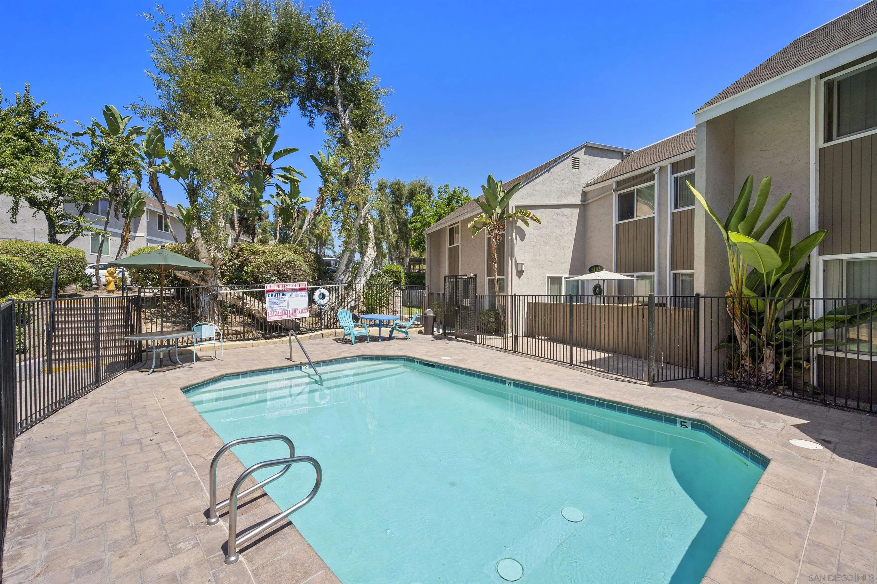 6333 College Grove Way, Unit 1101 (14) San Diego, CA 92115 - Photo 35 of 39 a view of a swimming pool with a patio