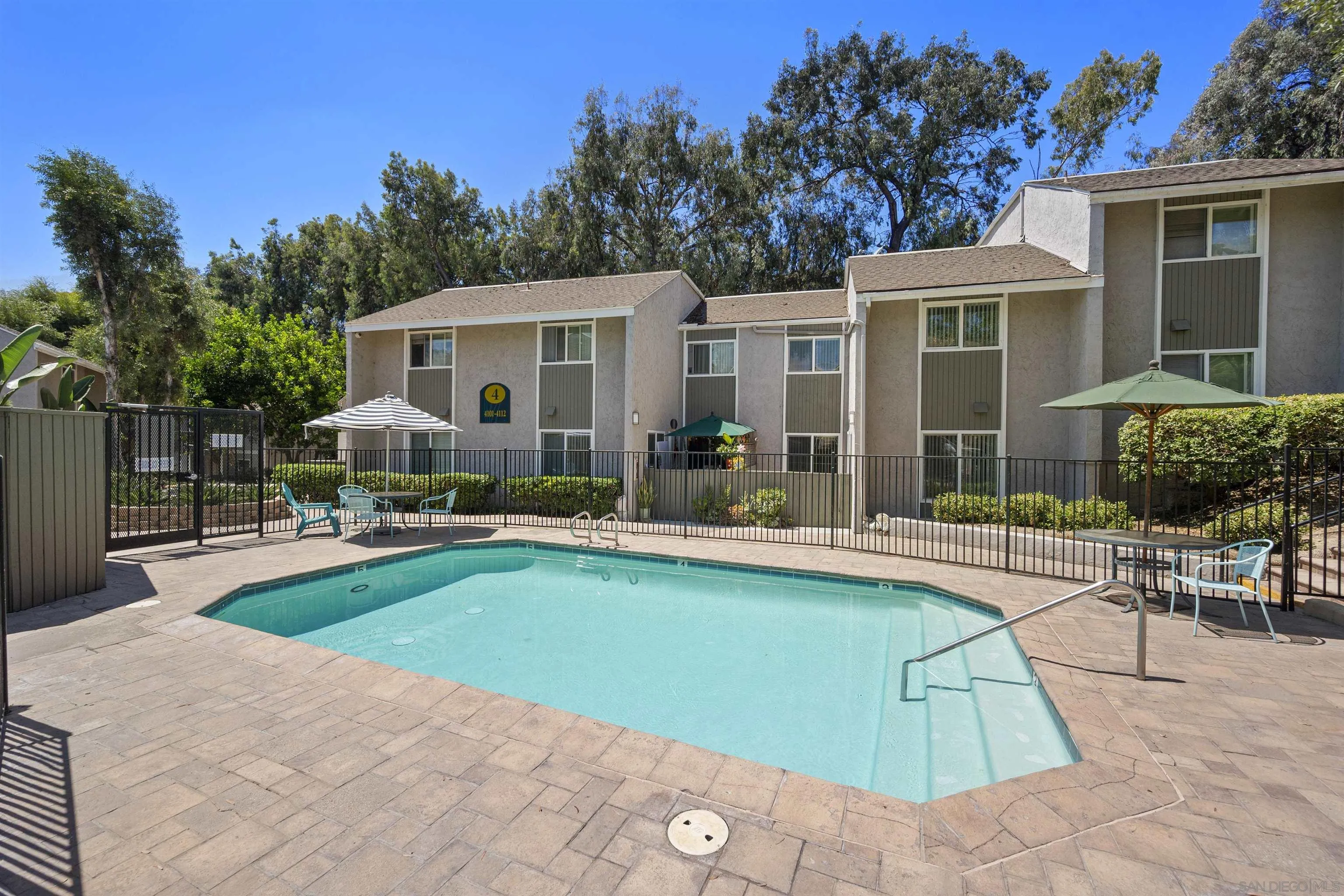 6333 College Grove Way, Unit 1101 (14) San Diego, CA 92115 - Photo 36 of 39 a view of a house with swimming pool and sitting area
