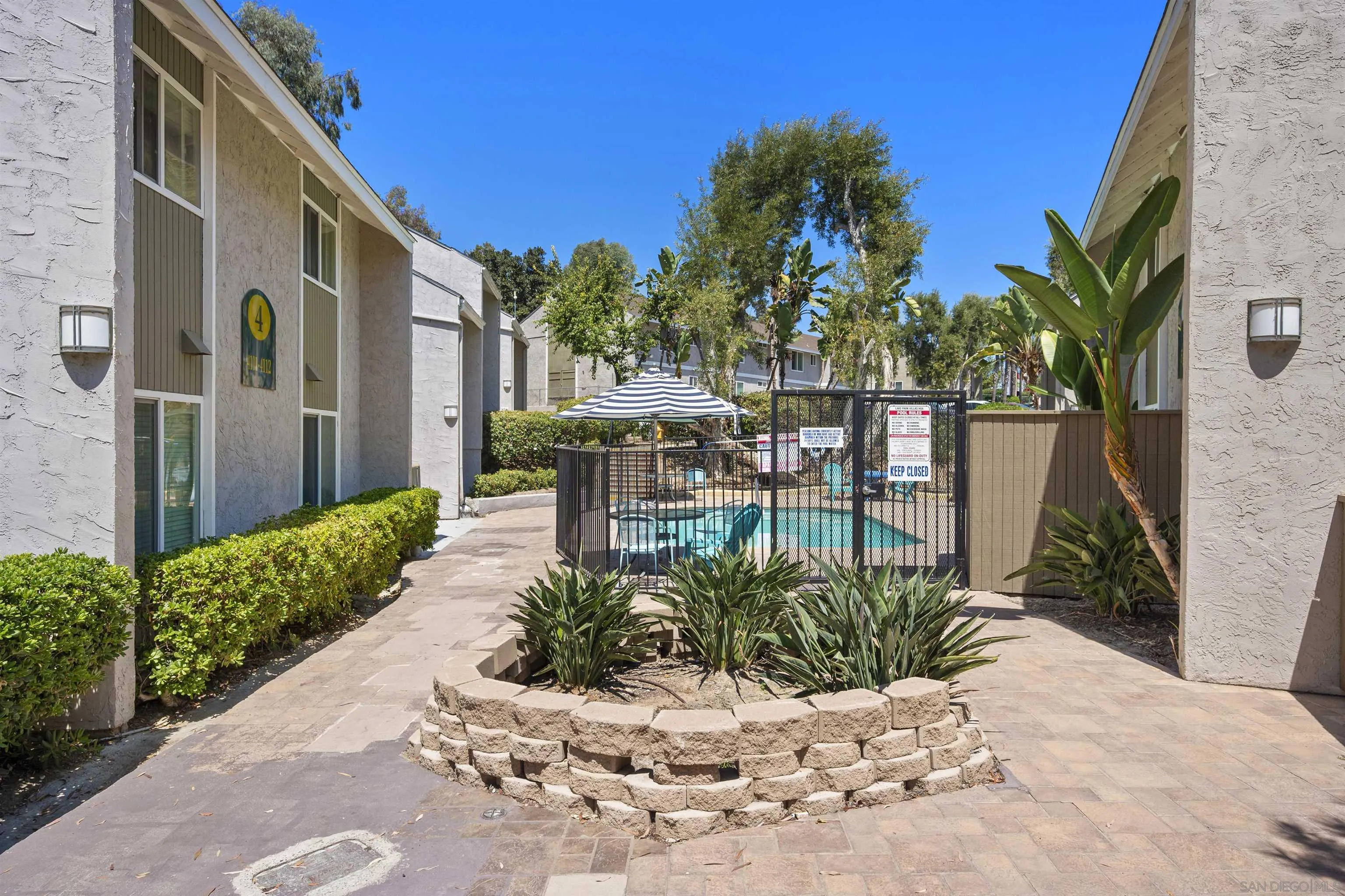 6333 College Grove Way, Unit 1101 (14) San Diego, CA 92115 - Photo 39 of 39 a view of a chair and table in the garden front of house