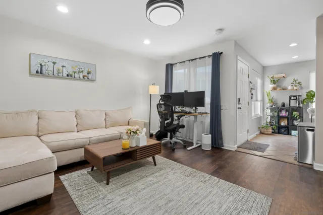 a view of a livingroom with furniture and a flat screen tv
