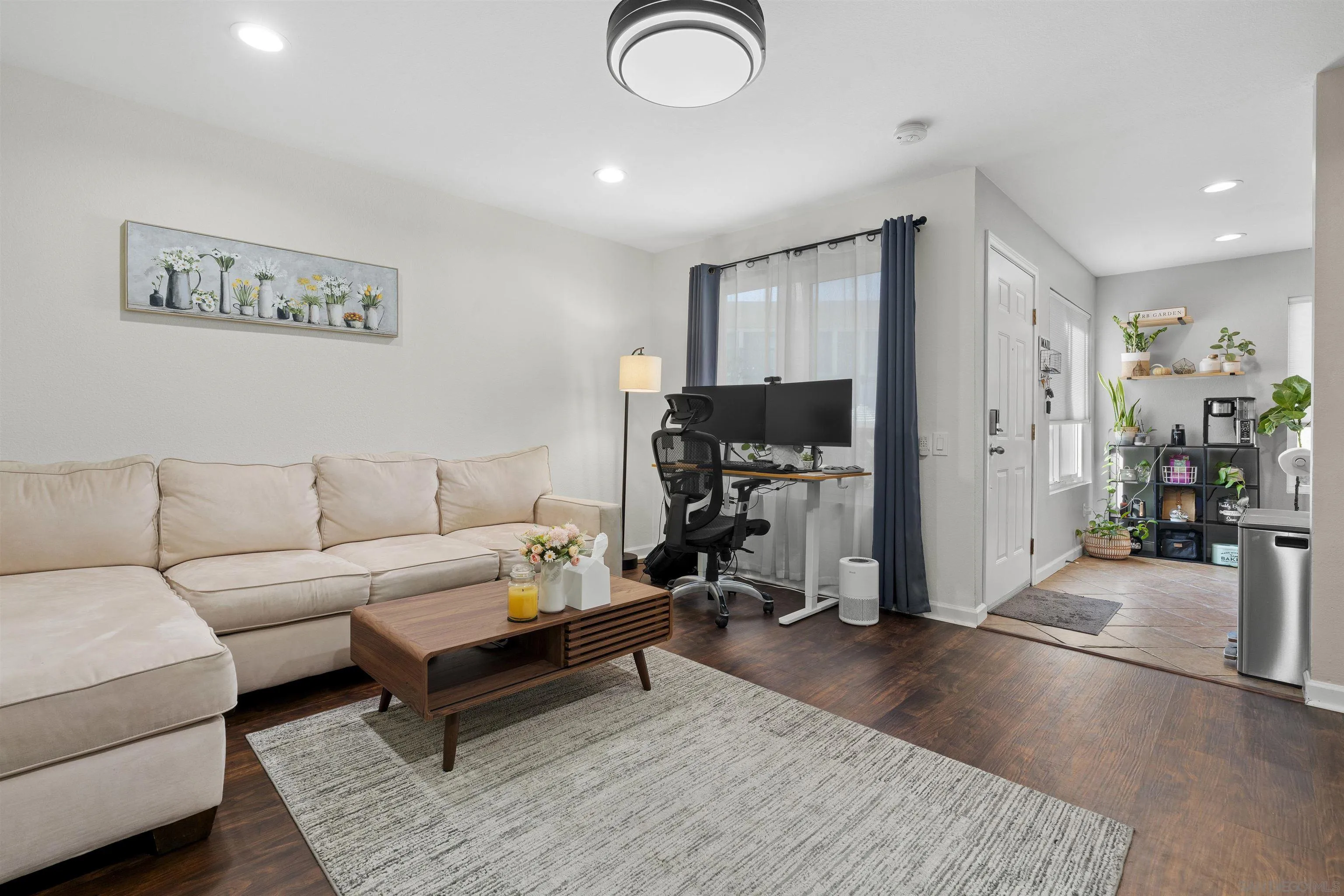 6333 College Grove Way, Unit 1101 (14) San Diego, CA 92115 - Photo 10 of 39 a living room with furniture and a flat screen tv
