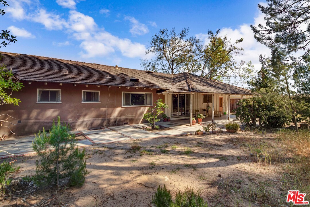 20490 Seaboard Road Malibu, CA 90265 - Photo 11 of 43 a view of a house with backyard and sitting area