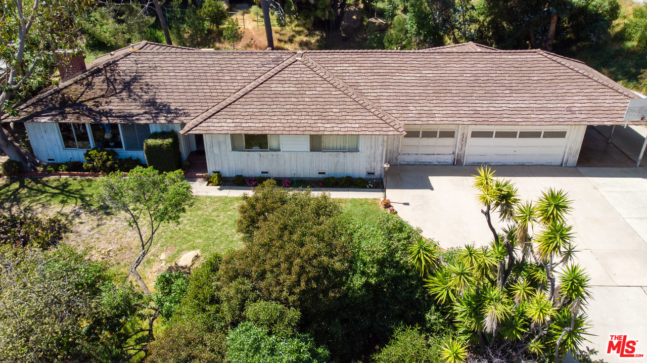 20490 Seaboard Road Malibu, CA 90265 - Photo 12 of 43 a aerial view of a house with swimming pool next to a yard