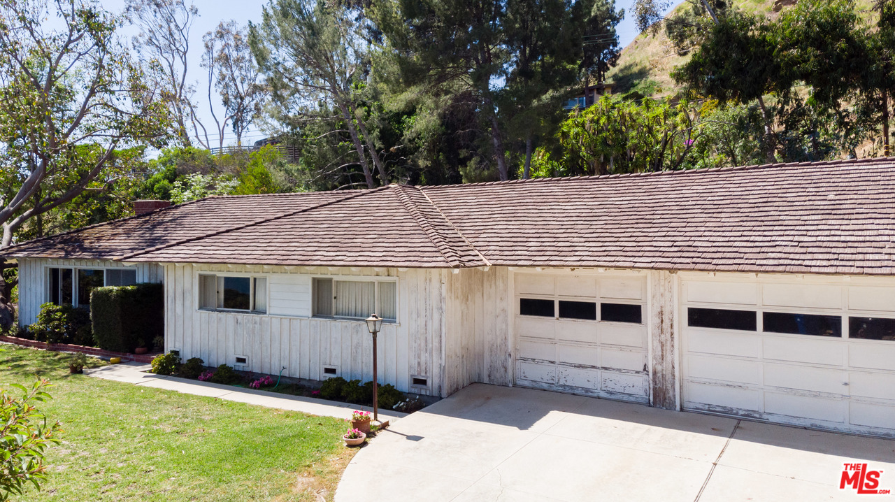 20490 Seaboard Road Malibu, CA 90265 - Photo 14 of 43 a house with trees in the background