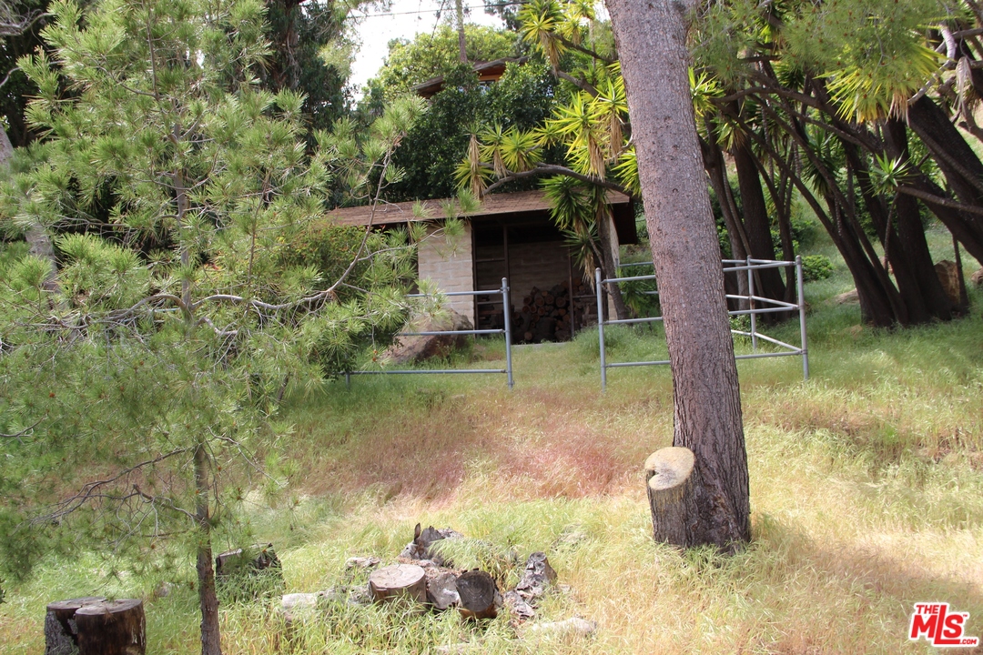 20490 Seaboard Road Malibu, CA 90265 - Photo 16 of 43 a backyard of a house with lots of green space