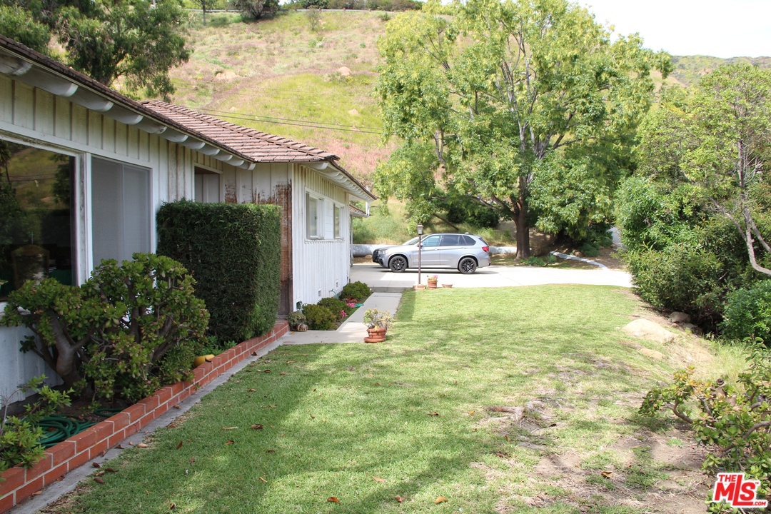 20490 Seaboard Road Malibu, CA 90265 - Photo 18 of 43 a house with trees in front of it