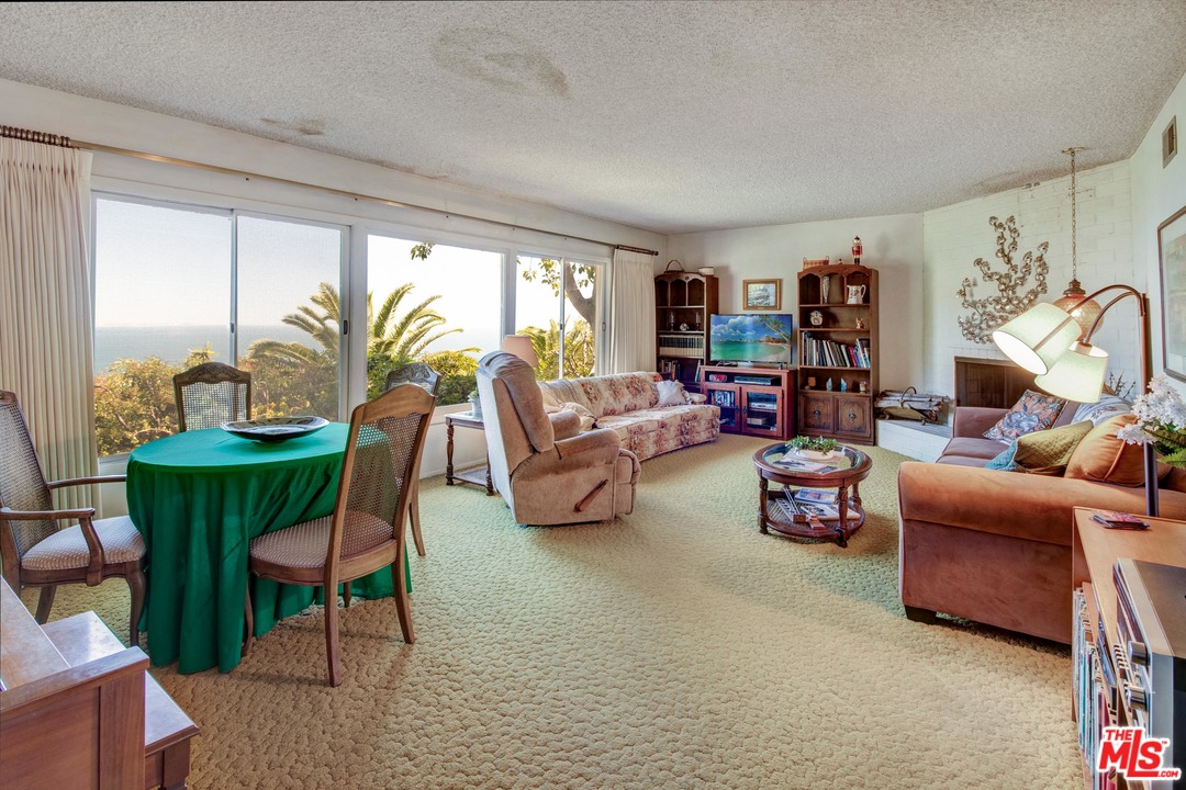 20490 Seaboard Road Malibu, CA 90265 - Photo 7 of 43 a living room with furniture and a large window