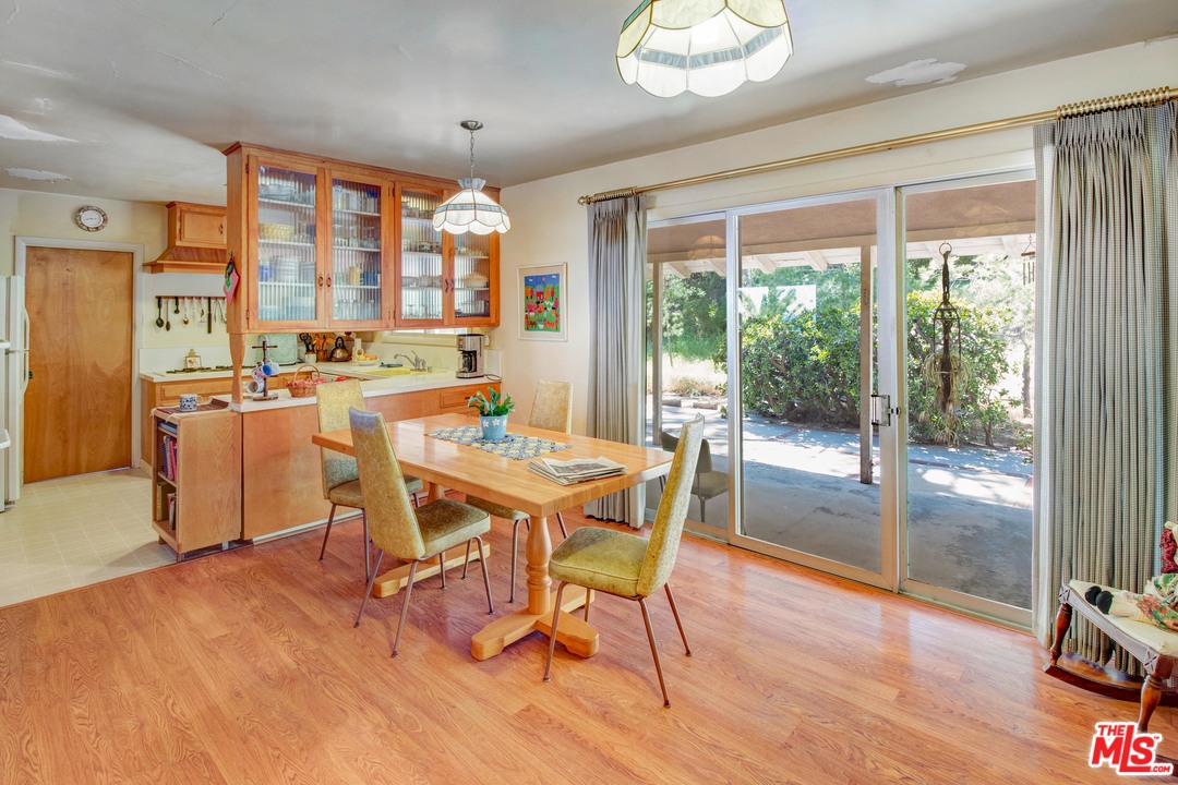 20490 Seaboard Road Malibu, CA 90265 - Photo 8 of 43 a dining room with wooden floor and large window