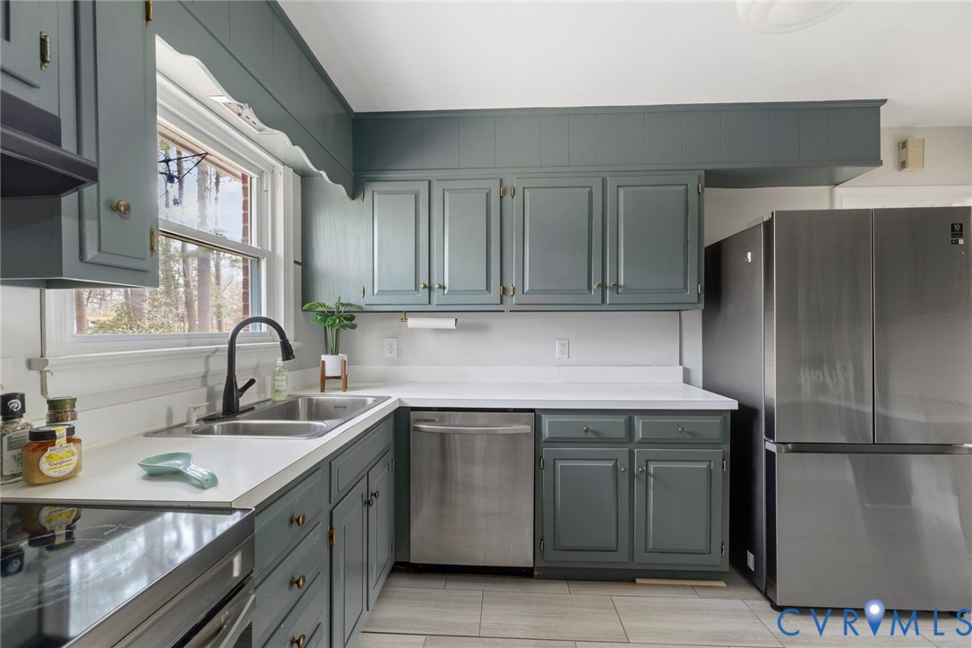 3407 Cooper Road Richmond, VA 23225 - Photo 15 of 33 a kitchen with a sink appliances and cabinets