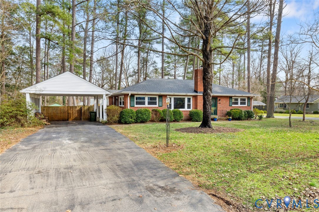 3407 Cooper Road Richmond, VA 23225 - Photo 2 of 33 a front view of a house with a yard and trees