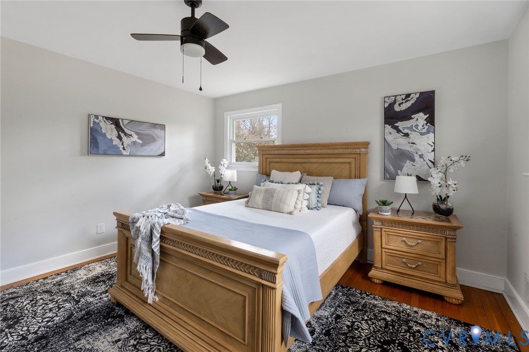 3407 Cooper Road Richmond, VA 23225 - Photo 22 of 33 a bedroom with a bed and a chandelier