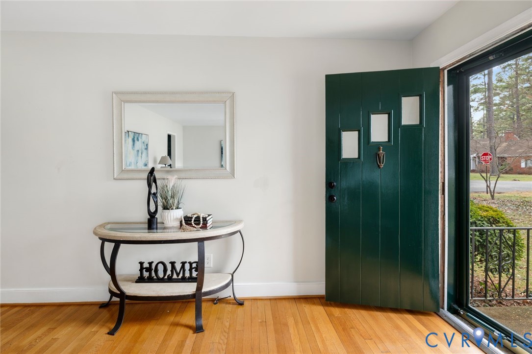 3407 Cooper Road Richmond, VA 23225 - Photo 5 of 33 a view of a room with wooden floor mirror and windows