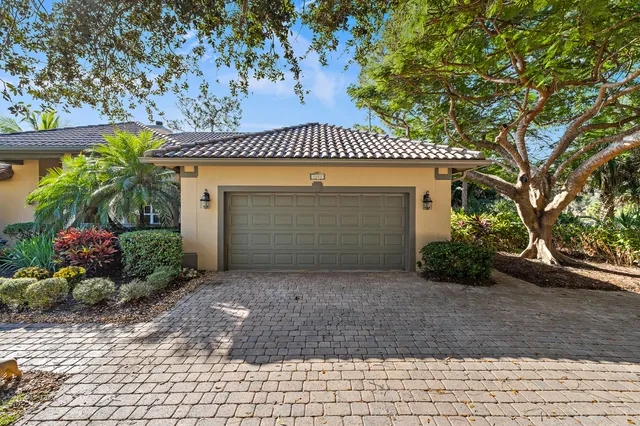 a living room with a fireplace and a rug