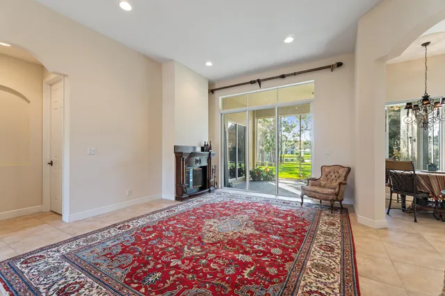 a kitchen with stainless steel appliances granite countertop a stove microwave and refrigerator