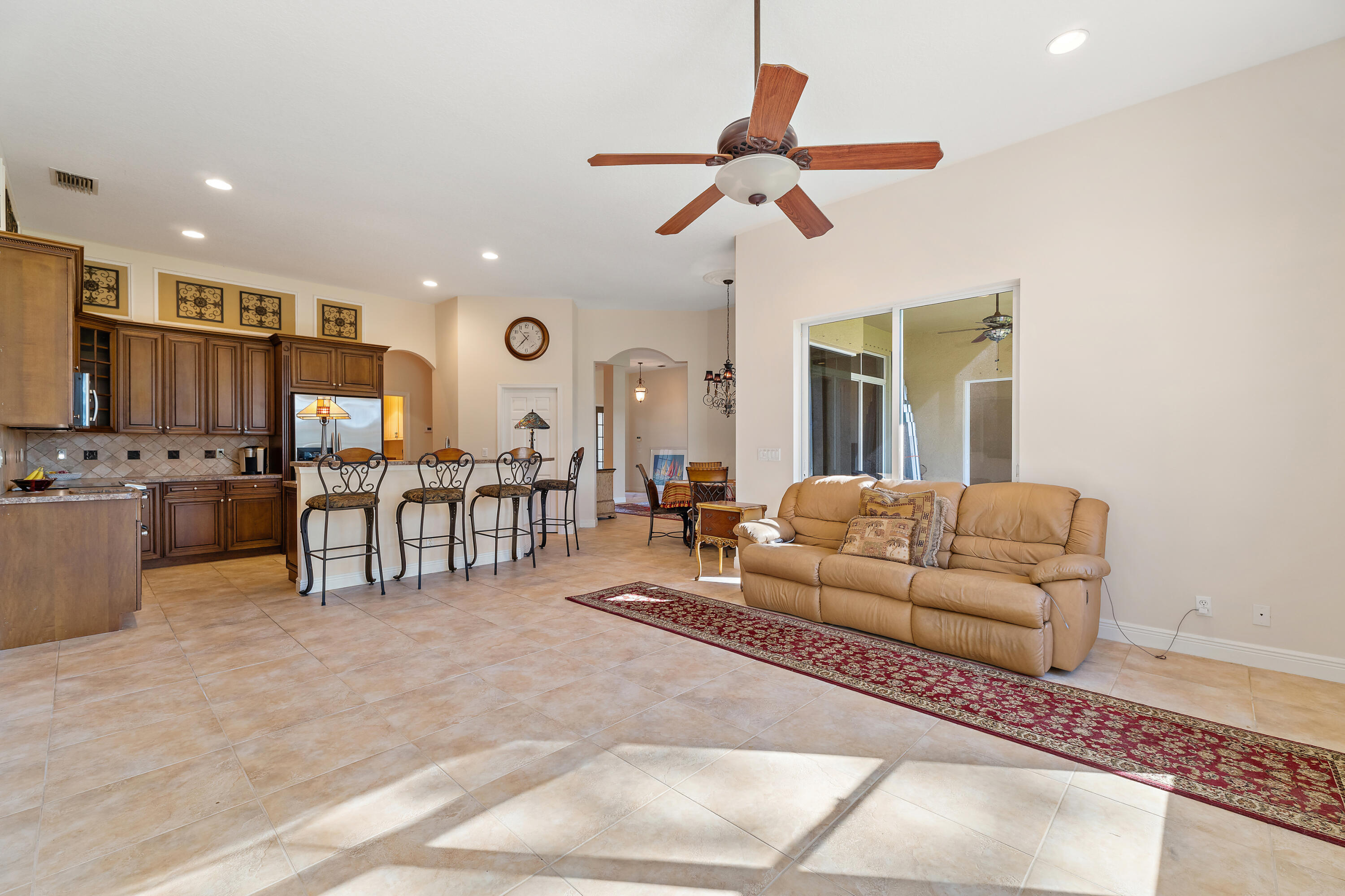 2650 Southwest Windship Way Stuart, FL 34997 - Photo 27 of 82 a living room with furniture and kitchen view