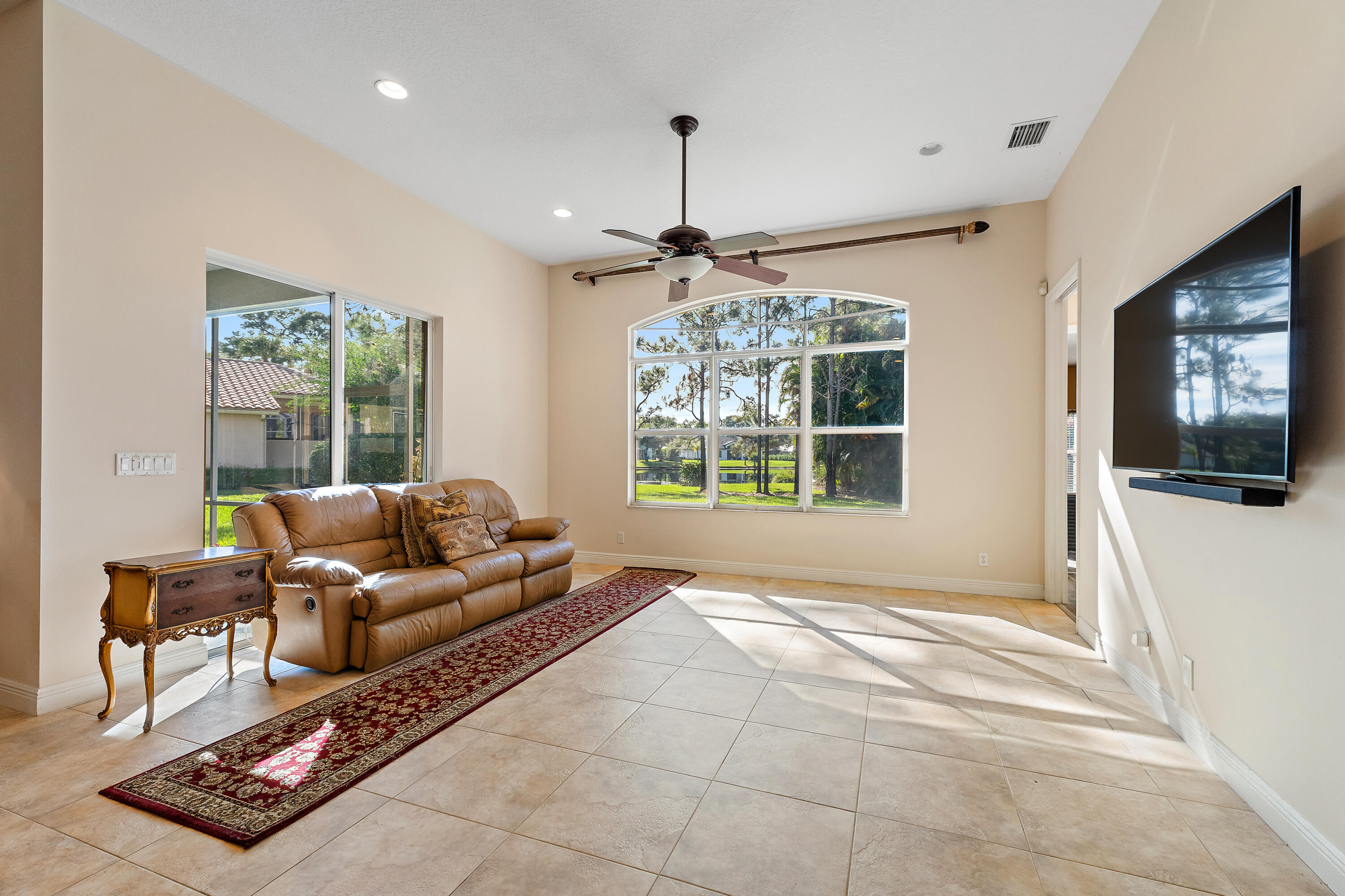 2650 Southwest Windship Way Stuart, FL 34997 - Photo 32 of 82 a living room with furniture and a window
