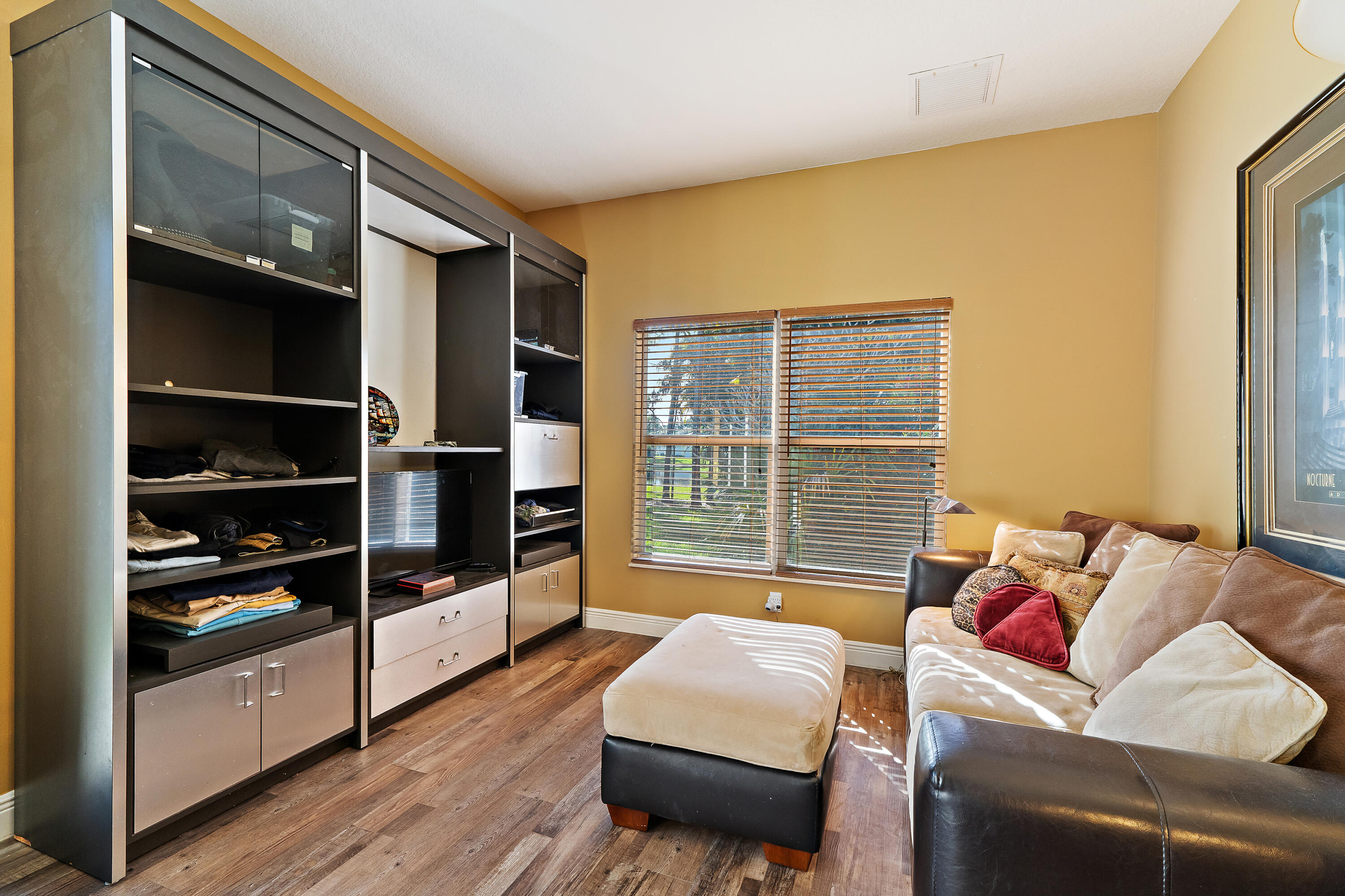 2650 Southwest Windship Way Stuart, FL 34997 - Photo 48 of 82 a bedroom with furniture and a large window