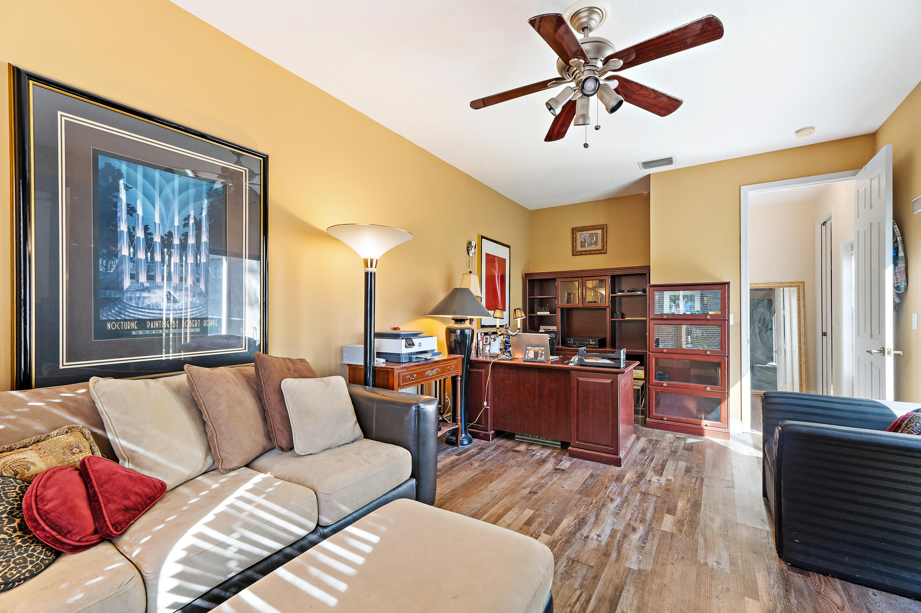 2650 Southwest Windship Way Stuart, FL 34997 - Photo 55 of 82 a living room with furniture and a wooden floor