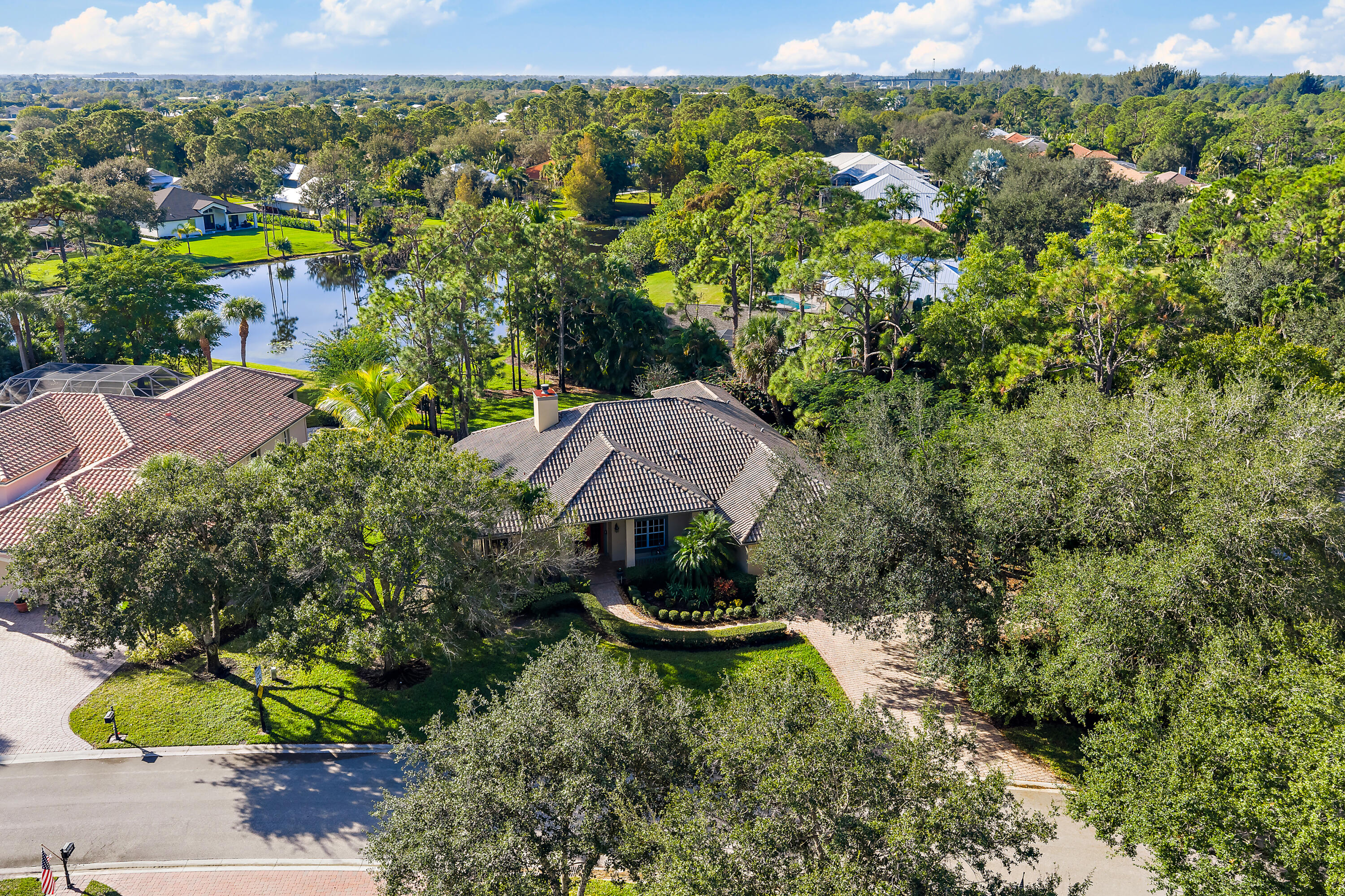 2650 Southwest Windship Way Stuart, FL 34997 - Photo 62 of 82 a view of a garden with a building in the background