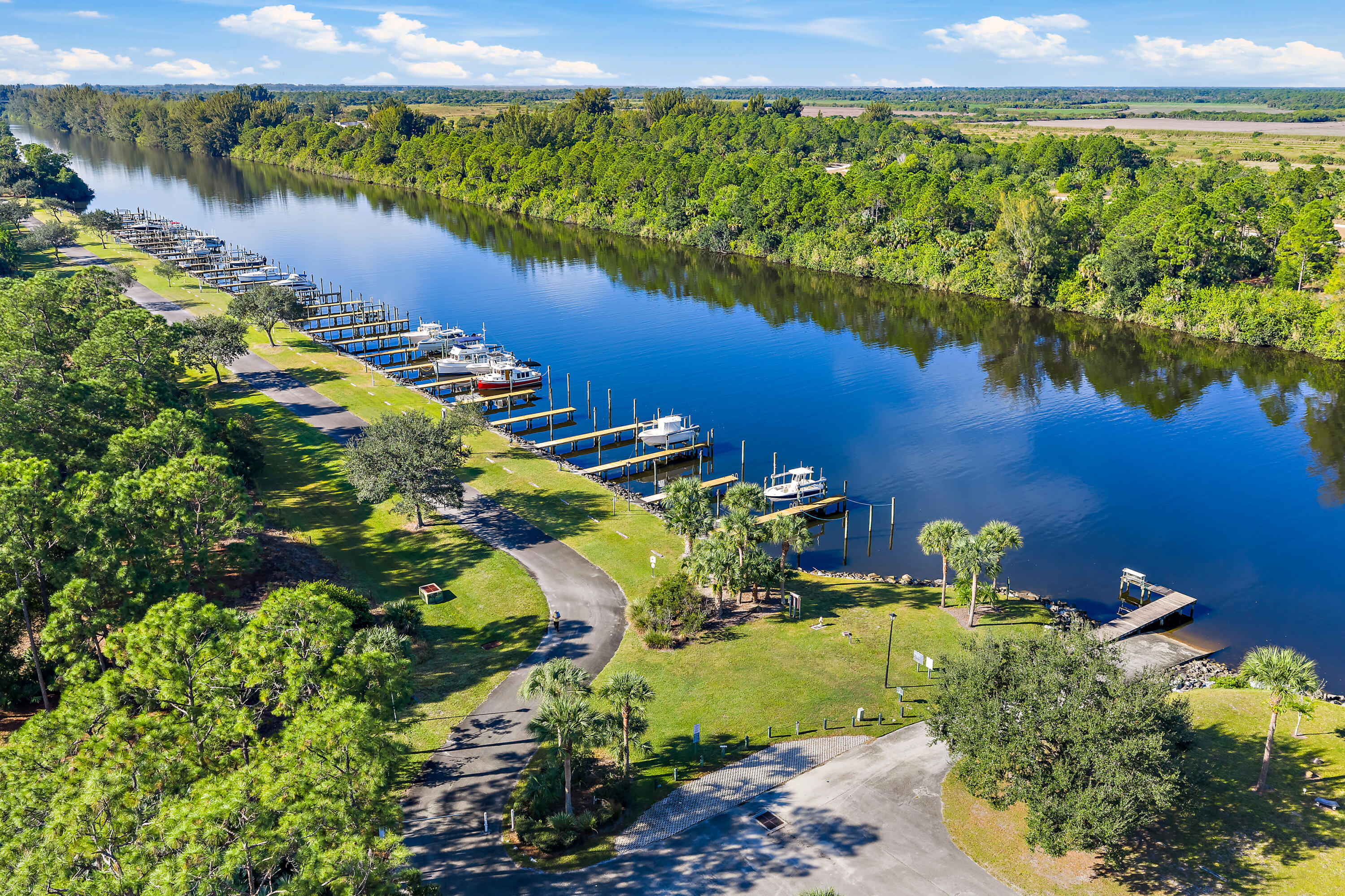 2650 Southwest Windship Way Stuart, FL 34997 - Photo 69 of 82 a view of a lake with a mountain in the background