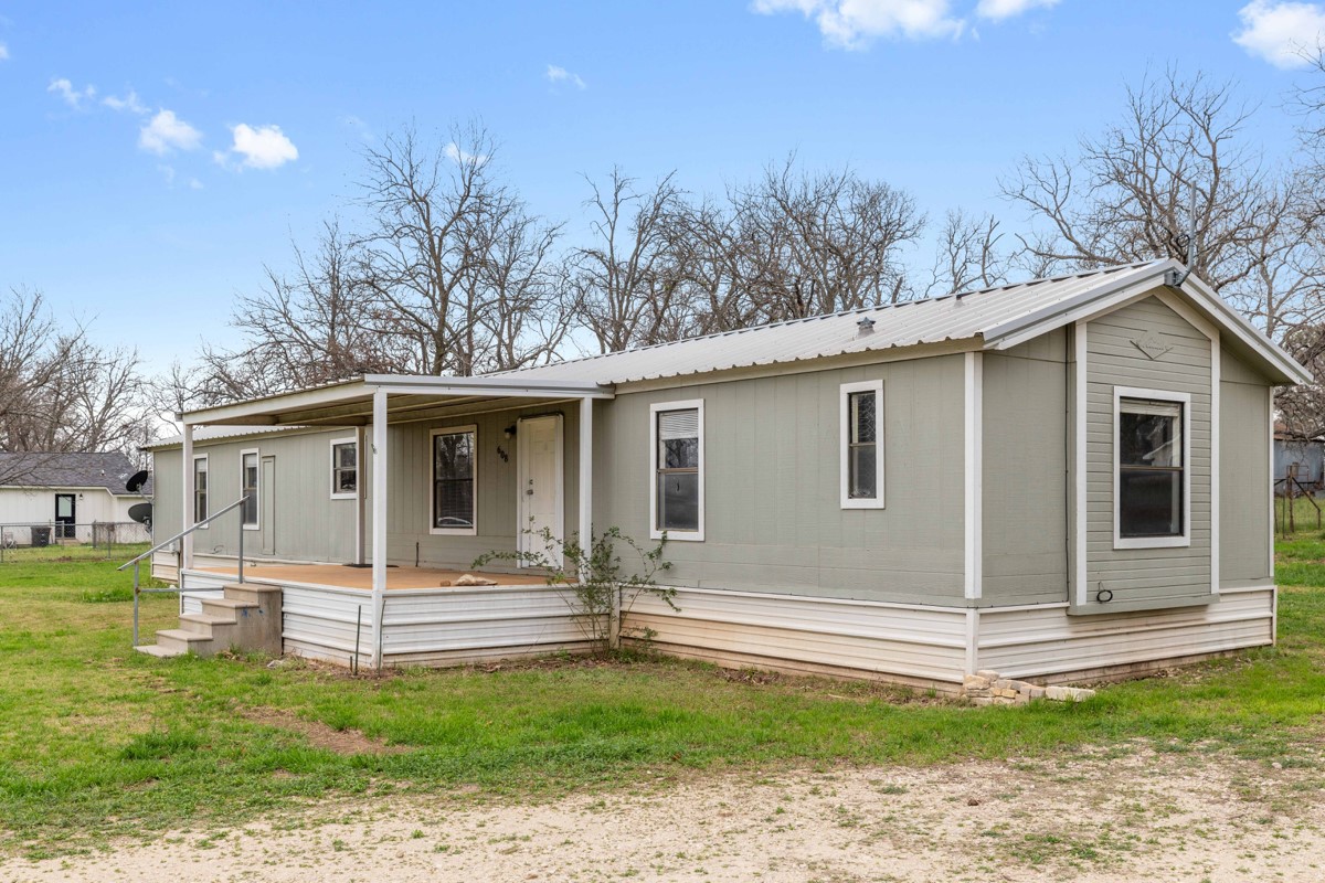 608 4th Street Blanket, TX 76432 - Photo 14 of 24 a view of a house with a yard
