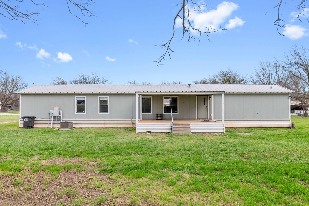 608 4th Street Blanket, TX 76432 - Photo 17 of 24 a front view of house with yard and seating area