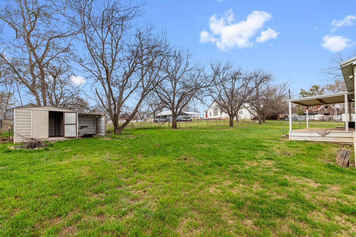 608 4th Street Blanket, TX 76432 - Photo 18 of 24 a view of a house with a big yard