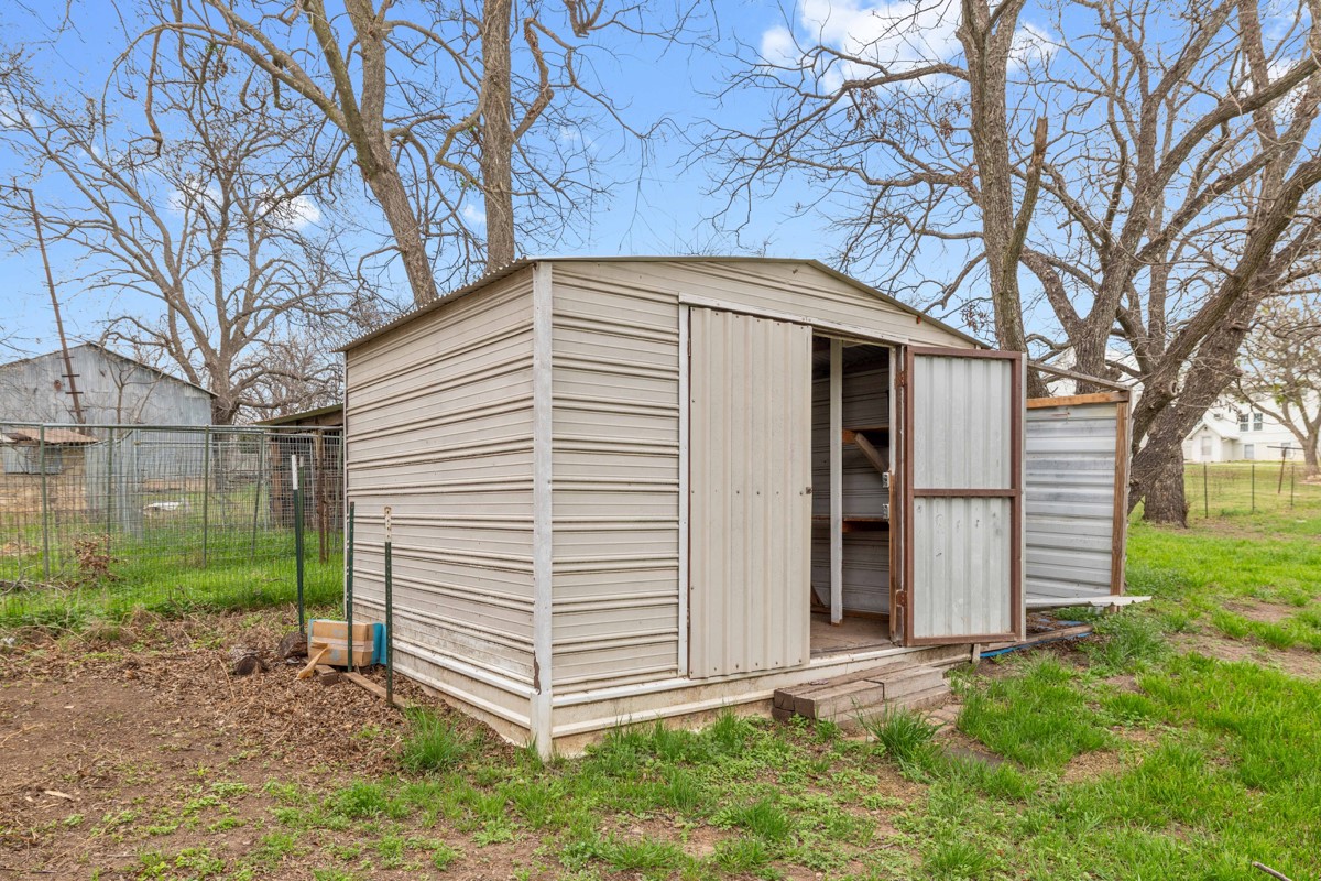 608 4th Street Blanket, TX 76432 - Photo 20 of 24 a front view of a house with garden