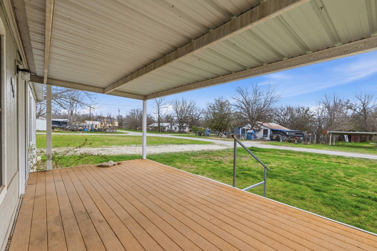608 4th Street Blanket, TX 76432 - Photo 22 of 24 a view of outdoor space with deck and green space