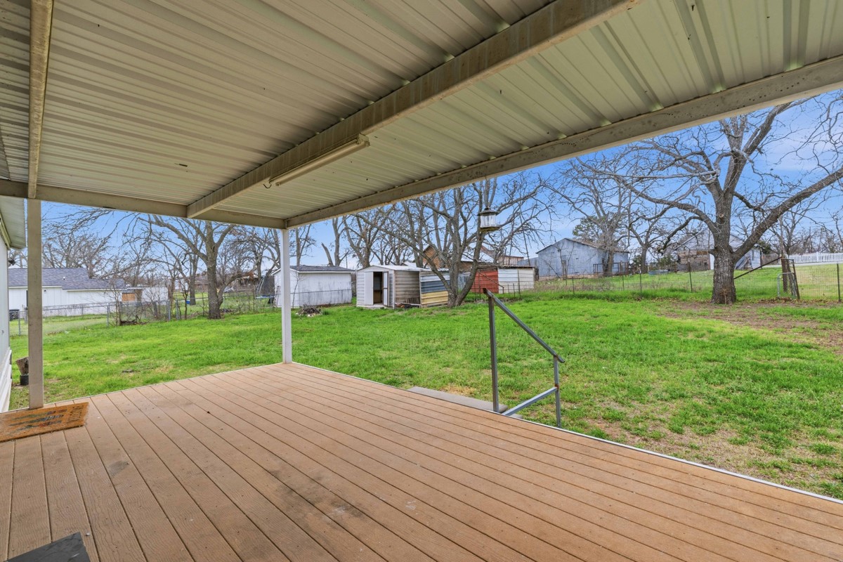 608 4th Street Blanket, TX 76432 - Photo 24 of 24 a view of a backyard with wooden fence