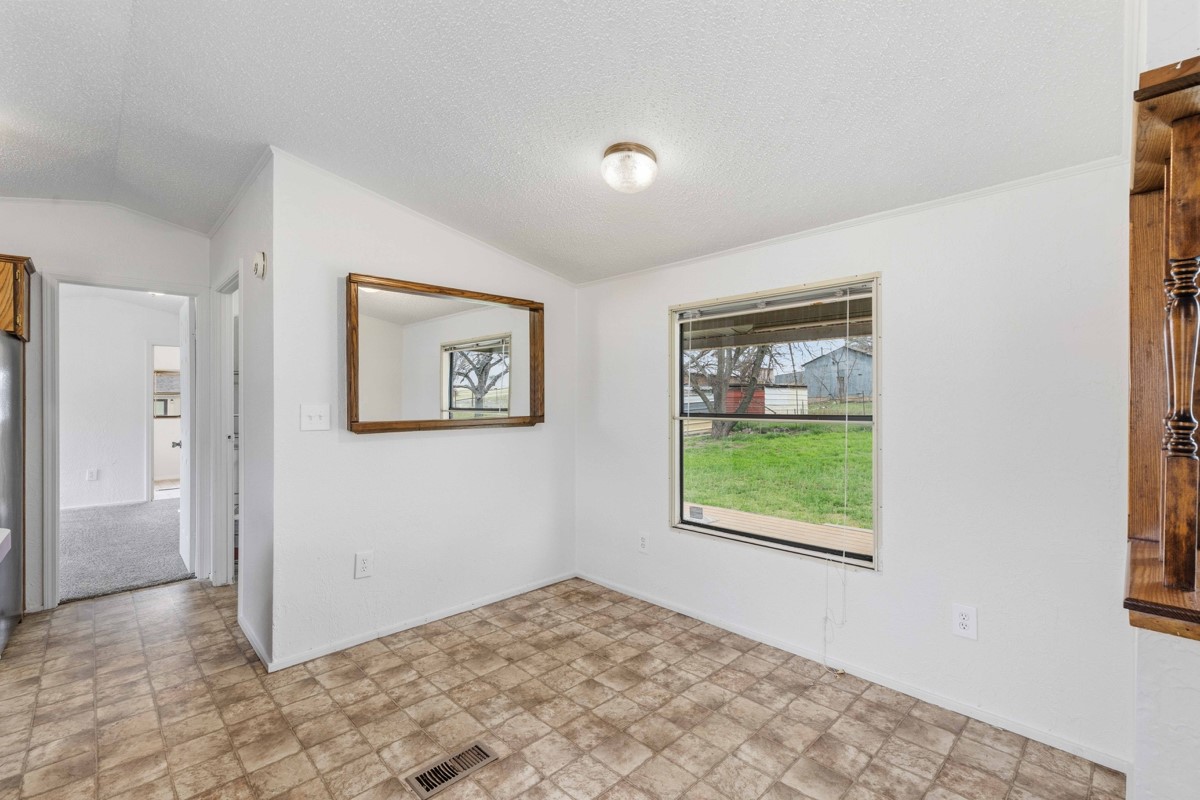608 4th Street Blanket, TX 76432 - Photo 5 of 24 a view of an empty room with a window